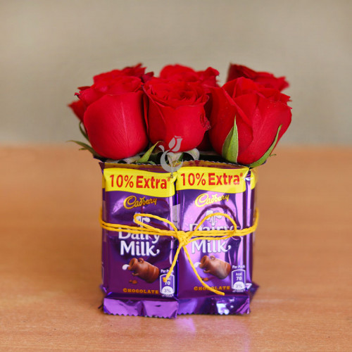 Chocolates and Roses: A Gift Combo of 8 Dairy Milk, 9 Red Roses, and Square Glass Vase