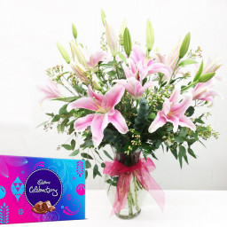 Special Surprise Arrangement: A Gift Combo of 7 Pink Lily with Vase Arrangement and One Celebration