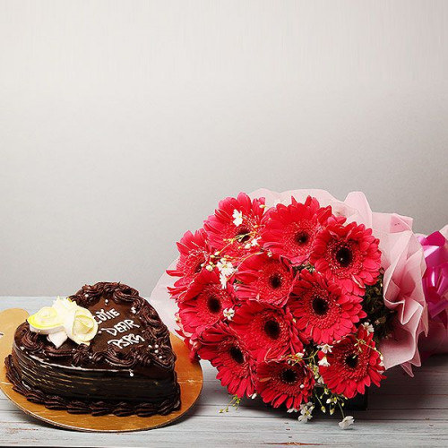 Promise To Love: A Gift Combo of 12 Red Gerberas and 0.5 Kg Heart Shape Chocolate Cake