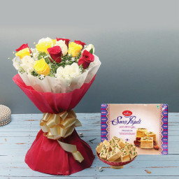 Devine Sweetness: A Gift Combo of 12 Mix Roses and 500 gm Soan Papdi.