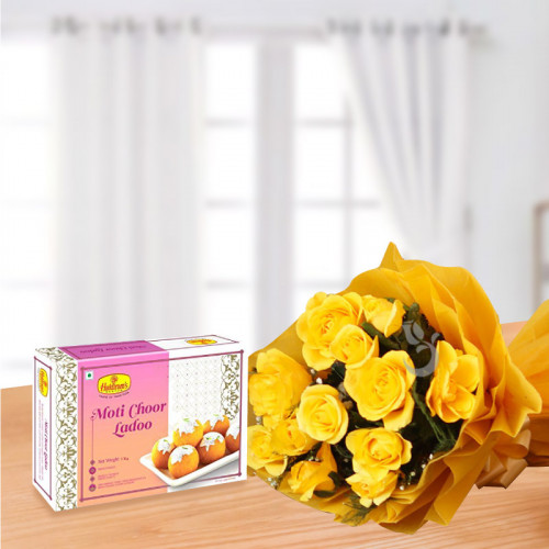 Coupled In Yellow: A Gift Combo of 12 Yellow Roses and 500 gm Besan Ladoo.