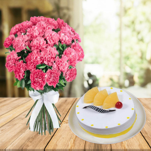 United To Gratify: A Gift Combo of 20 Pink Carnations and 0.5 kg Pineapple Cream Cake