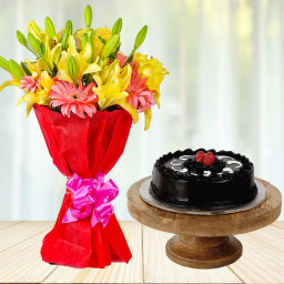 Vibes That Matches Yours: A Gift Combo of 8 Yellow Lilies, 6 Pink Gerberas and 0.5 kg Dark Truffle Cream Cake
