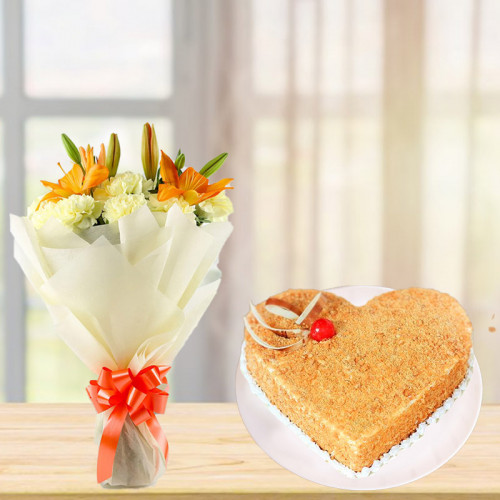 Bundle Of Love Lush: A Gift Combo of 10 Yellow Carnations, 2 Yellow Lilies and 0.5 kg Heart-Shaped Butterscotch Cake