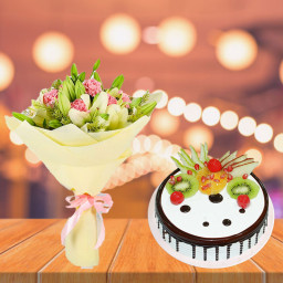 Let's You Feel Whole: A Gift Combo of 4 White Lilies, 10 Pink Carnations and 0.5 kg Fruit Cake