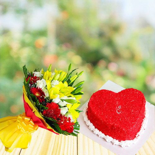 Manifestation Of Love: A Gift Combo of 6 Yellow Lilies, 12 White Roses, 10 Red Gerberas and 1 kg Heart-Shaped Red Velvet Cake