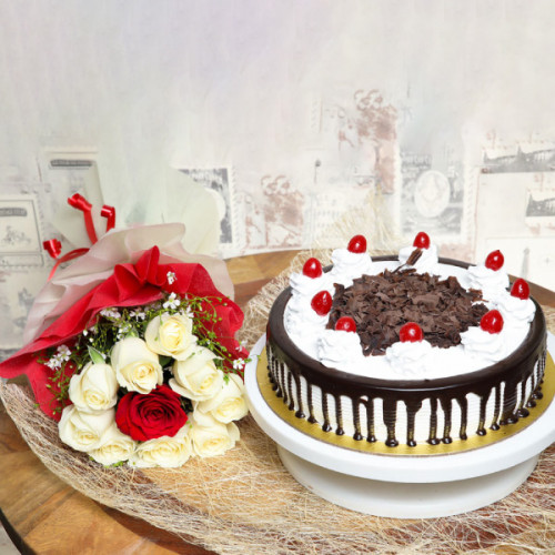 Sunset Harmony: A Gift Combo of 9 White and 1 Red Rose and 0.5 kg Black Forest Cake