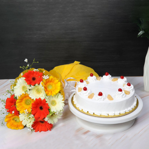 Sunny Medley: A Gift Combo of 10 Mix Gerberas and 0.5 Kg Pineapple Cake
