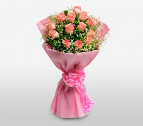 10 Pink Roses n Truffle cake: A Gift Combo of 10 Pink Roses and 0.5 Kg Chocolate Cake