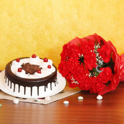 Classic Delight: A Gift Combo of 10 red carnations and 0.5 kg Black Forest cake