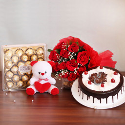 Fondest Memories: A Gift Combo of 10 red roses, 6 inch teddy, 0.5 kg Black Forest cake and 24 pcs Ferrero Rocher