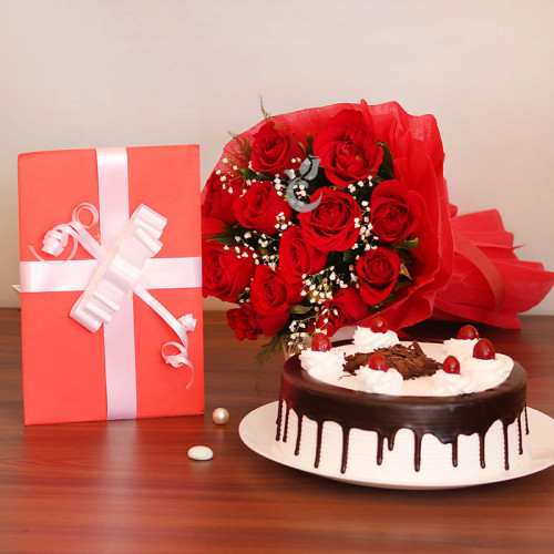 Abundant Love: A Gift Combo of 10 red roses, greeting card and 0.5 kg Black Forest cake