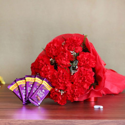 Sweet Perfection: A Gift Combo of 10 red carnations and 5 Dairy Milk chocolates