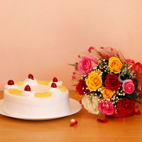 Delightful Treat: A Gift Combo of 8 Mix Roses and 0.5 Kg Pineapple Cake