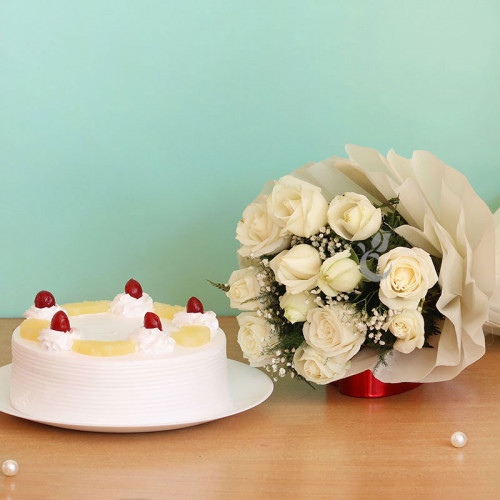Serene White: A Gift Combo of 12 White Roses and 0.5 Kg Pineapple Cake