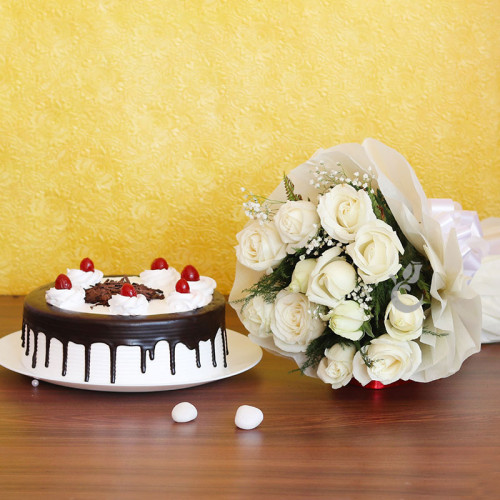 Fairytale Bliss: A Gift Combo of 12 White Roses and 0.5 Kg Blackforest Cake