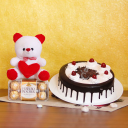 Fabulous Fascination: A Gift Combo of 6 Inch Teddy, 0.5 Kg Black Forest Cake and 16 Ferrero Rocher