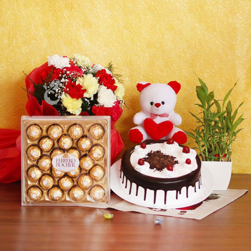 Lucky Combo: A Gift Combo of 12 Mix Carnations, 0.5 Kg Black Forest Cake, Lucky Bamboo, 6 Inch Teddy and 24 Ferrero Rocher