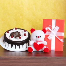 Sweet Greetings: A Gift Combo of 1 Lucky Bamboo, 0.5 Kg Black Forest Cake and 1 Greeting Card