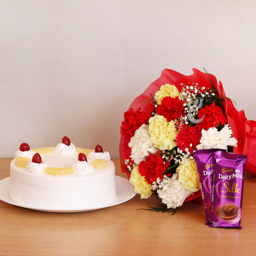 Carnation Festival: A Gift Combo of 12 Mix Carnations, 0.5 Kg Pineapple Cake and 2 Dairy Milk Silk