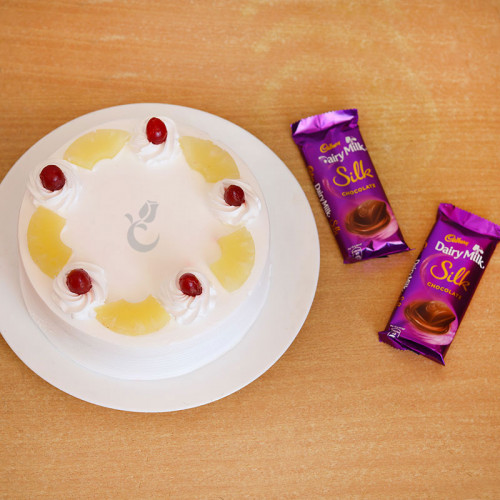 Sweet Castle: A Gift Combo of 2 Dairy Milk Silk and 0.5 Kg Pineapple Cake