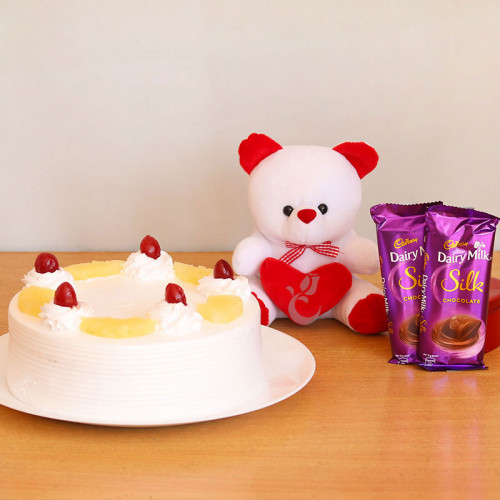 Truly Yours: A Gift Combo of 2 Dairy Milk Silk, 0.5 Kg Pineapple Cake and 6 Inch Teddy