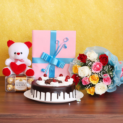 Joy to the World: A Gift Combo of 6 Inch Teddy, 0.5 Kg Black Forest Cake, 12 Mix Roses, Greeting Card and 16 Ferrero Rocher Chocolates