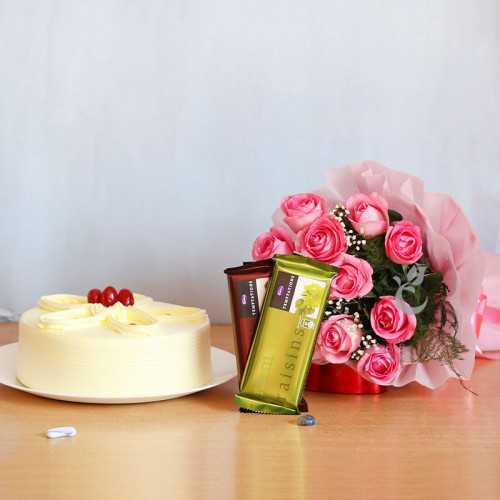 Dreamy Decadence: A Gift Combo of 12 Pink Roses, 0.5 Kg Butterscotch Cake and 2 Temptation