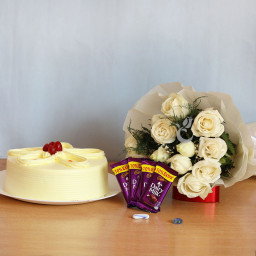 Sweet Desire: A Gift Combo of 12 White Roses, 0.5 Kg Butterscotch Cake and 5 Dairy Milk