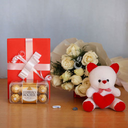 Cuteness Overloaded: A Gift Combo of 12 White Roses, 6 Inch Teddy, 16 pcs Ferrero Rocher and 1 Greeting Card