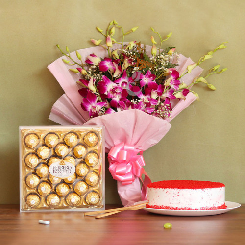 Beauty Bliss: A Gift Combo of 6 Orchids, 0.5 Kg Red Velvet Cake and 24 Ferrero Rocher
