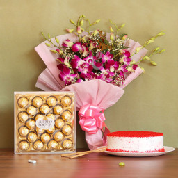 Beauty Bliss: A Gift Combo of 6 Orchids, 0.5 Kg Red Velvet Cake and 24 Ferrero Rocher