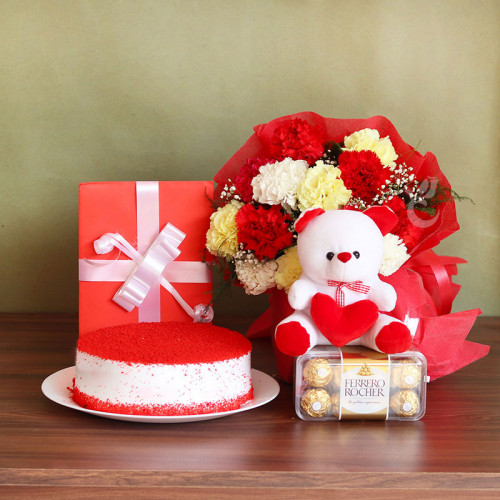 Crafted with Cuteness: A Gift Combo of 12 Mix Carnation, 6 Inch Teddy, Greeting Card, 0.5 Kg Red Velvet Cake, and 16 Ferrero Rocher
